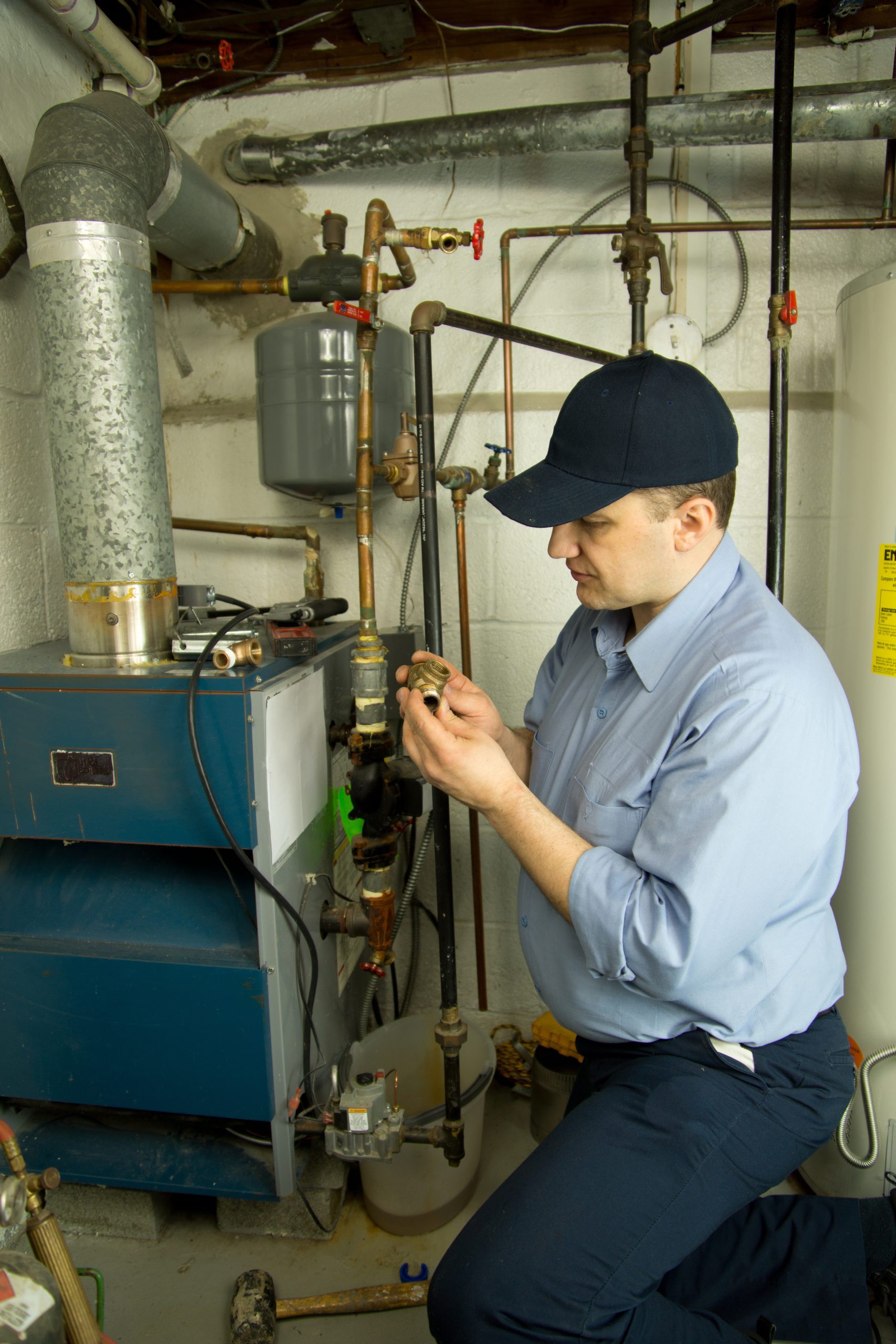 Garnett Heating & Air tech installing new furnace.