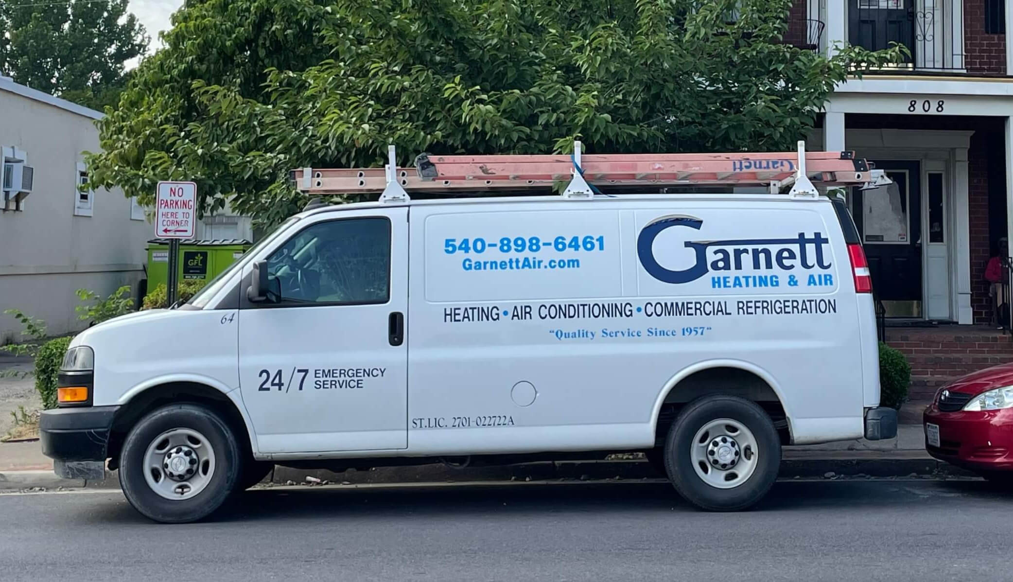 AC Maintenace Garnett work van outside home in fredericksburg preparign for AC maintenance.